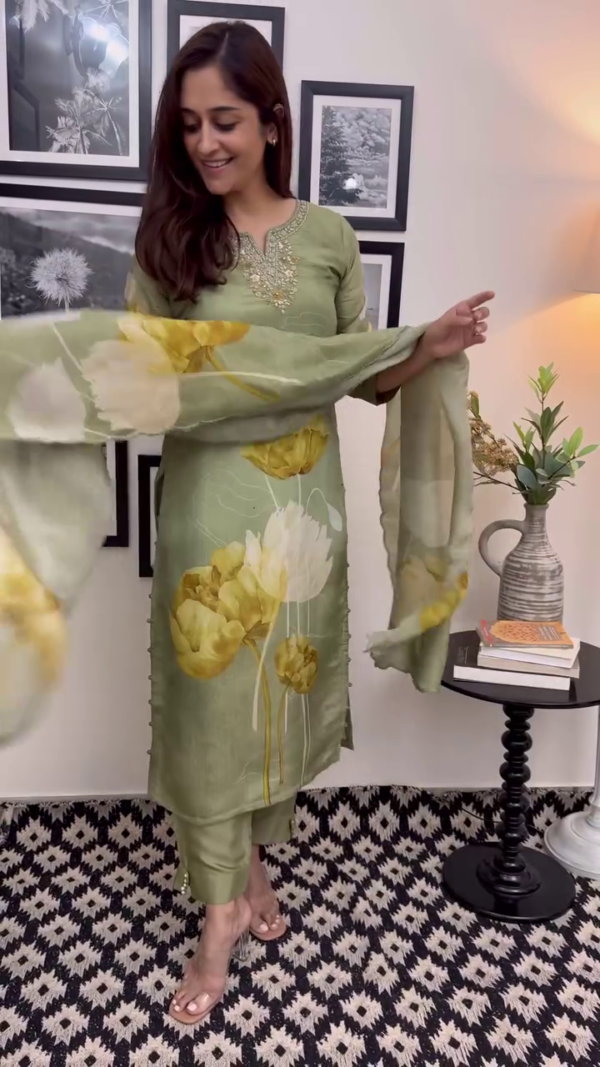 Light Olive Green Floral Printed Suit Set with Intricate Neck Embroidery, Pearl Detailing on Sleeves, Matching Dupatta, and Tapered Pants – A Perfect Blend of Subtle Glamour and Everyday Grace
