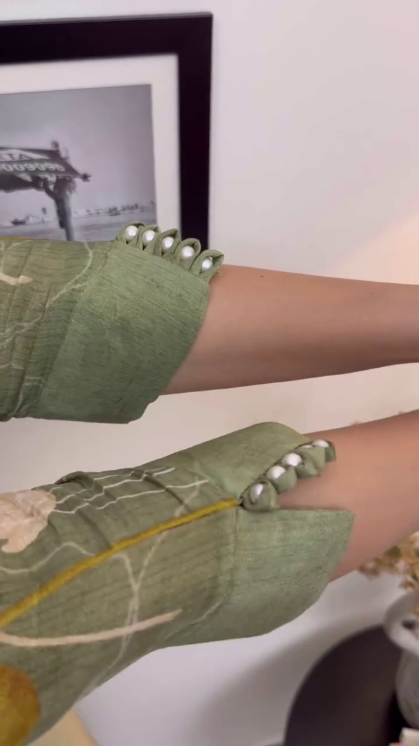 Light Olive Green Floral Printed Suit Set with Intricate Neck Embroidery, Pearl Detailing on Sleeves, Matching Dupatta, and Tapered Pants – A Perfect Blend of Subtle Glamour and Everyday Grace - Image 4