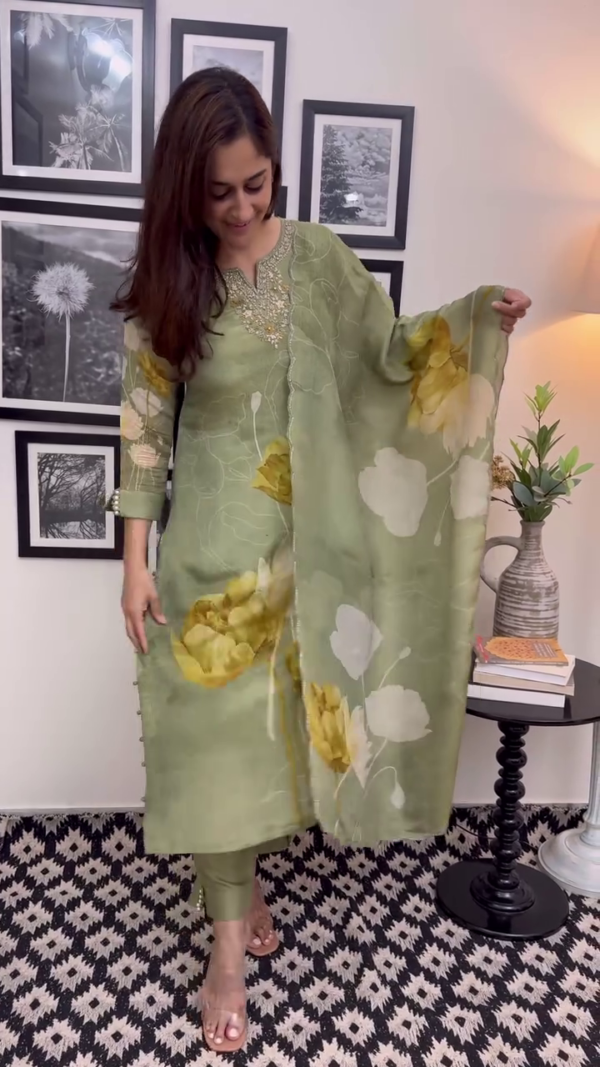 Light Olive Green Floral Printed Suit Set with Intricate Neck Embroidery, Pearl Detailing on Sleeves, Matching Dupatta, and Tapered Pants – A Perfect Blend of Subtle Glamour and Everyday Grace - Image 2