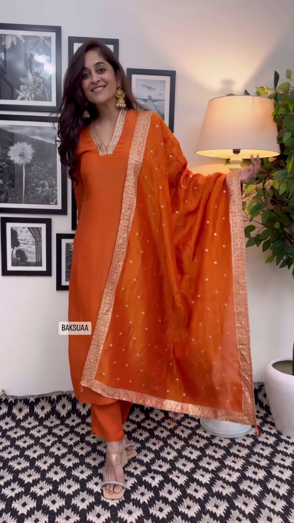 Orange Silk Straight Kurta Set with Intricate Mirror Work Neckline, Embroidered Border Dupatta, and Coordinated Pants Festive and Ethnic Wear