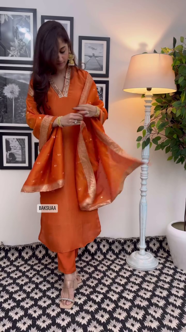 Orange Silk Straight Kurta Set with Intricate Mirror Work Neckline, Embroidered Border Dupatta, and Coordinated Pants Festive and Ethnic Wear - Image 3