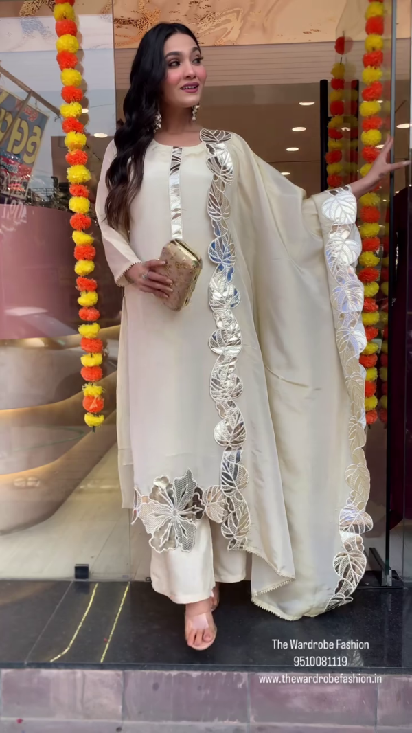 Cream Designer Cape Style Palazzo Set with Mirror Work Detailing and Floral Embroidery, Paired with a Coordinated Inner and Clutch – Perfect for Festive and Party Wear - Image 2