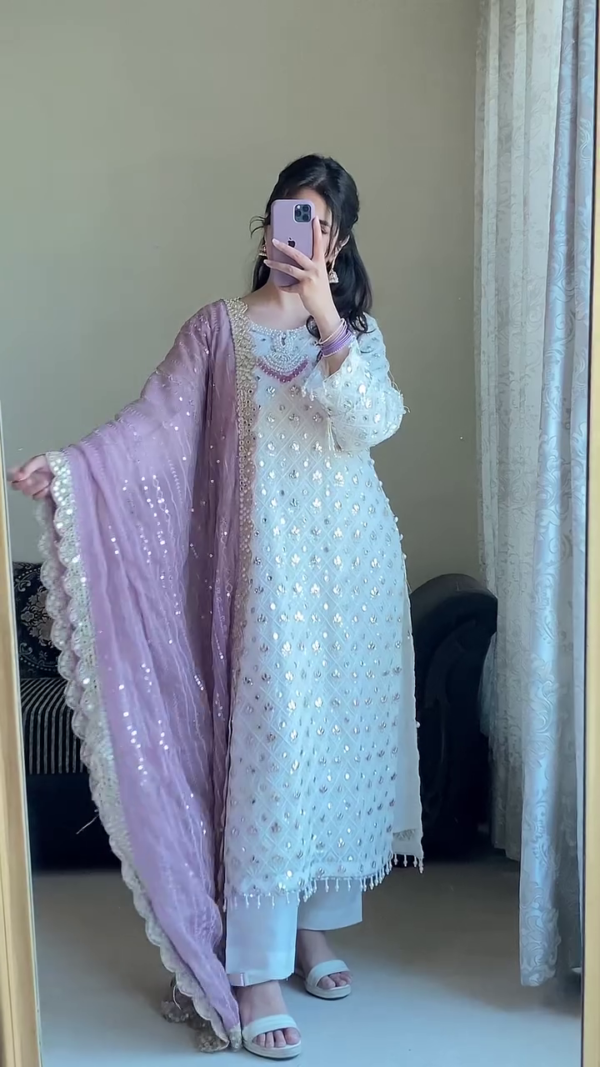 White Embroidered Formal Suit with Mirror Work Detailing, Paired with Contrasting Dupattas – Soft Lilac Net Dupatta and Rich Maroon Velvet Dupatta, Perfect for Festive and Traditional Occasions