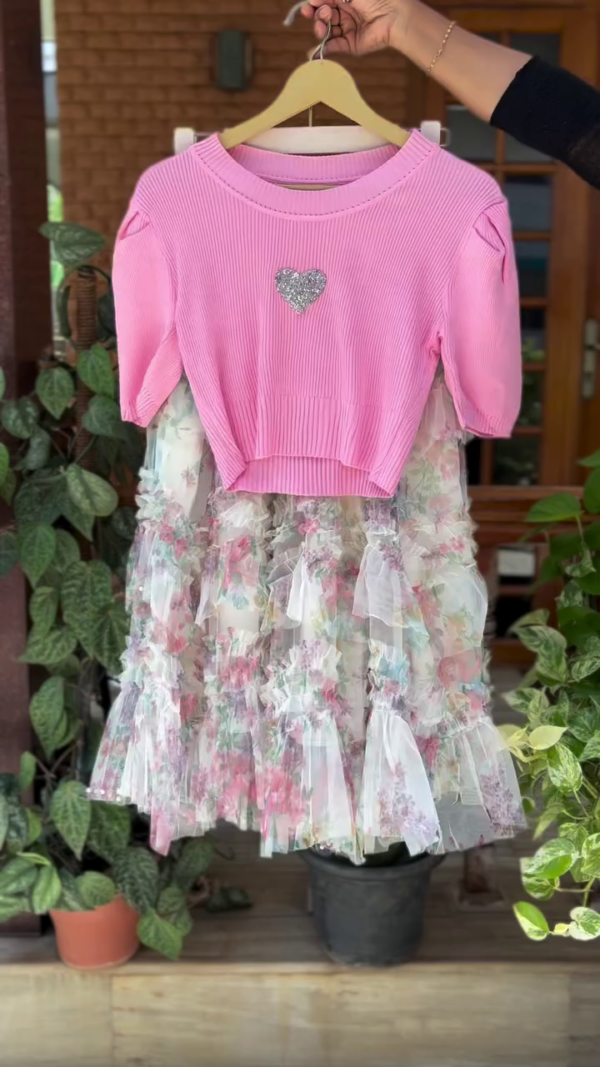 Charming Pink Ribbed Knit Crop Top with Glitter Heart Patch Paired with Pastel Floral Ruffled Net Skirt Embellished with Delicate Pearls – Ideal for Parties, Birthdays, and Casual Outings