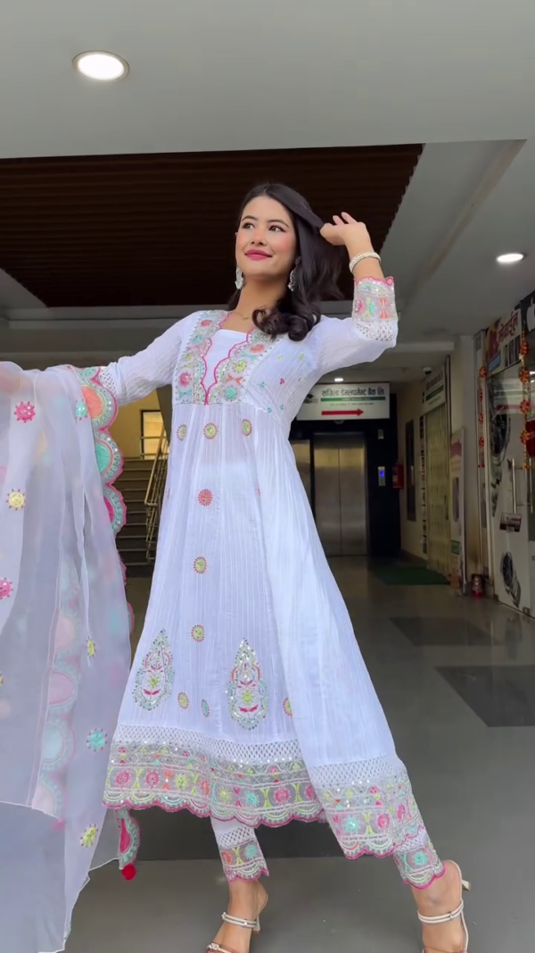 White Anarkali Style Suit Set with Vibrant Multicolor Mirror and Thread Embroidery, Paired with Matching Embellished Dupatta and Pants – Perfect for Festive and Ethnic Occasions