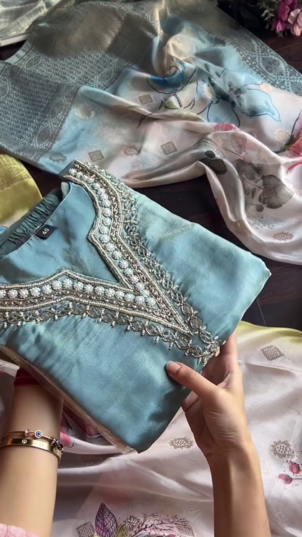 Elegant Sky Blue Kurta Set Featuring Delicate Mirror and Pearl Hand Embroidery on a V-Neckline, Paired with a Subtle Off-White Jacquard Dupatta – Perfect for Daytime Festivities, Minimalist Ethnic Looks, and Elegant Gatherings