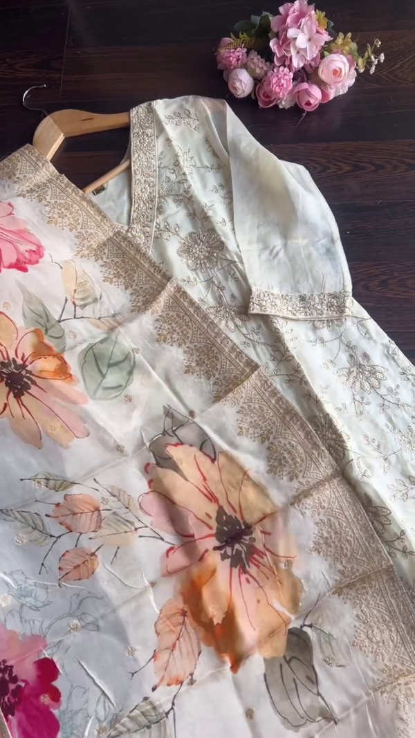 Elegant Off-White Silk Kurta Set Featuring Delicate Golden Thread and Sequin Embroidery, Paired with a Flowing Organza Dupatta Accentuated by Bold Multicolor Floral Prints – Perfect for Daytime Festivities and Graceful Gatherings - Image 2