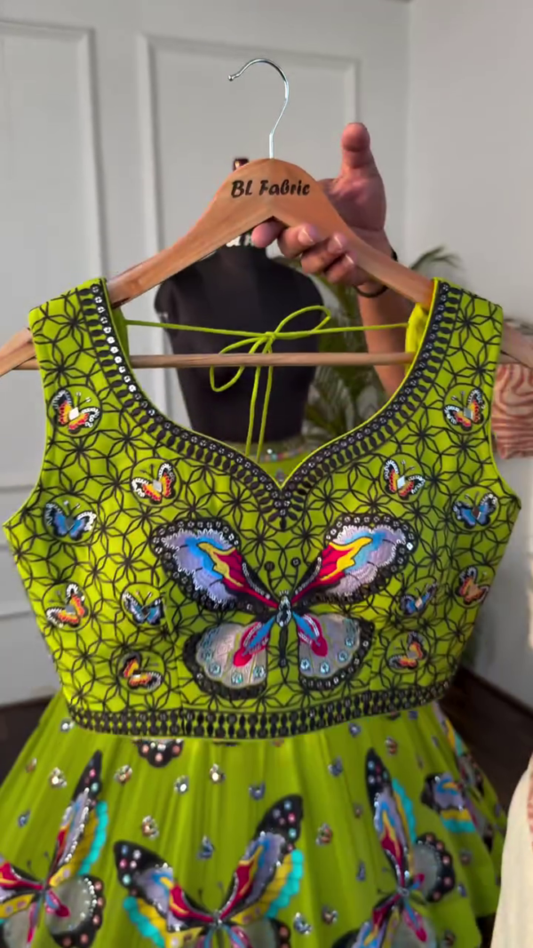 Vibrant Lime Green Lehenga Choli Set Featuring Colorful Butterfly Embroidery on Blouse and Flared Skirt, Accentuated with Intricately Embellished Borders, Coordinated Tassels, and Matching Dupatta – A Playful yet Elegant Festive Ensemble - Image 2
