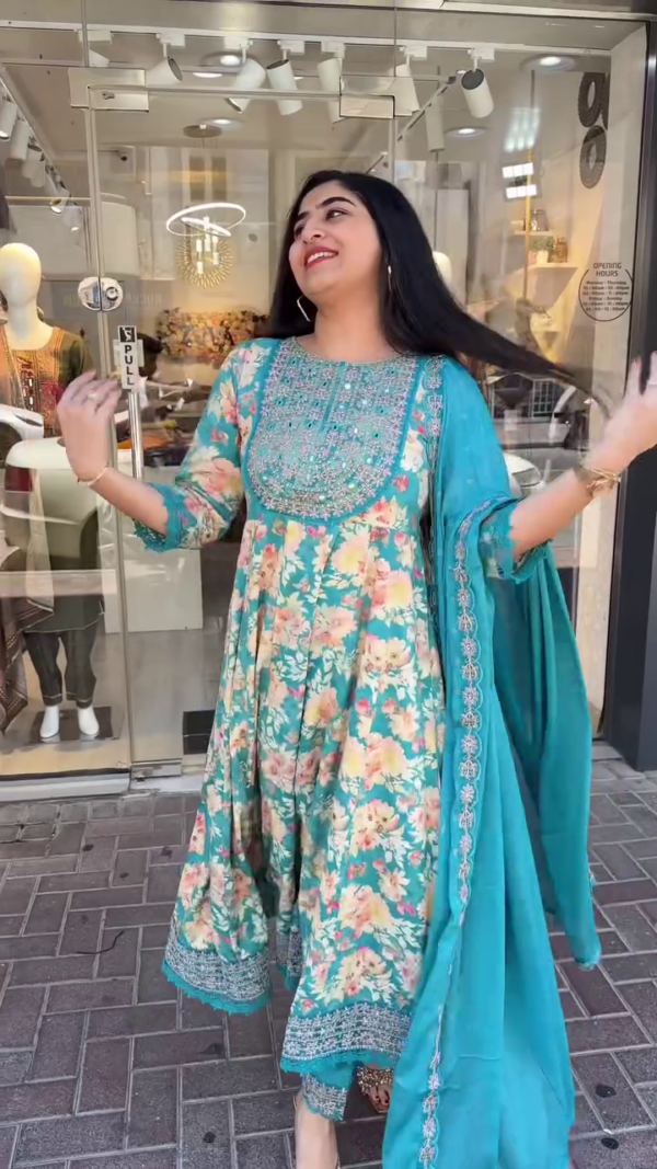 Floral Printed Anarkali Suit Set Featuring Intricately Embroidered Yoke, Paired with Matching Churidar and Embellished Dupatta – Ideal for Festive Celebrations, Daytime Functions, and Traditional Gatherings in Vibrant Teal and Soothing Pink Tones