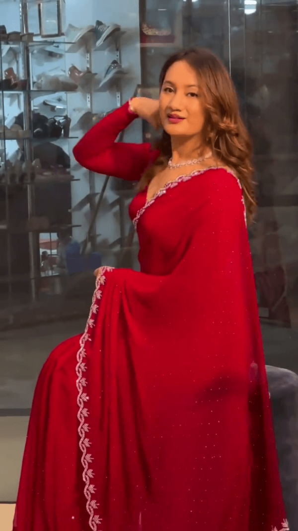 Red Georgette Saree with Intricate Stone Embellished Border and Matching Designer Blouse for Festive and Party Wear