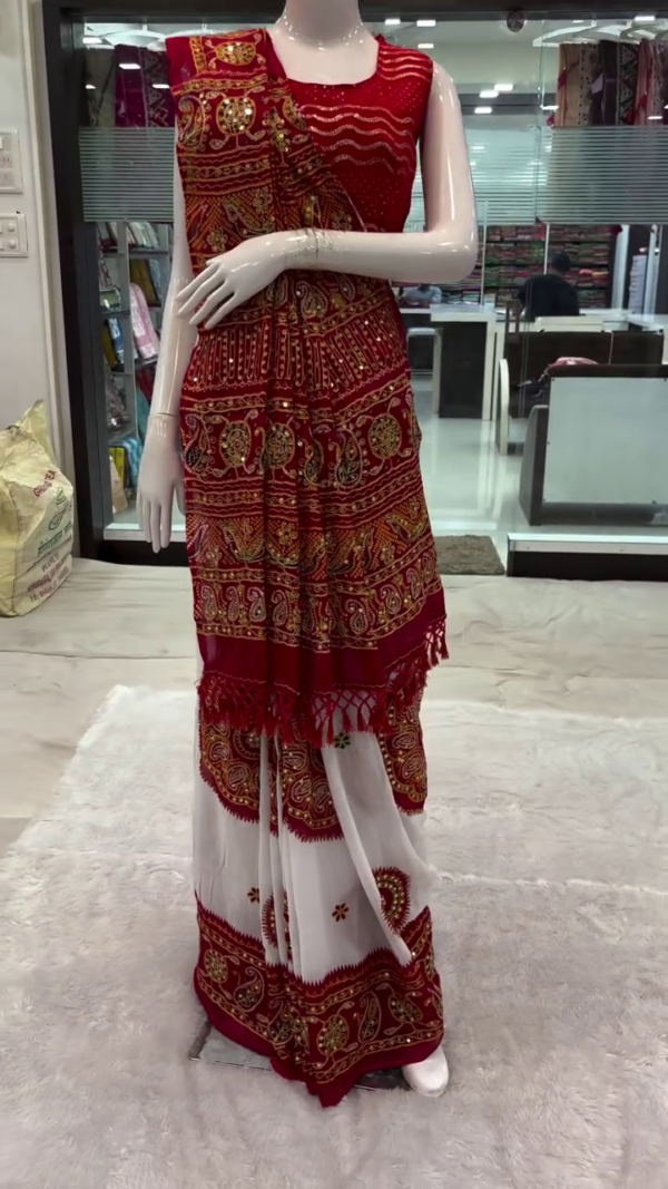 Traditional Red and White Bandhani Print Saree with Intricate Mirror Work and Embroidered Pallu – Ethnic Rajasthani/Gujarati Style for Festive and Cultural Occasions