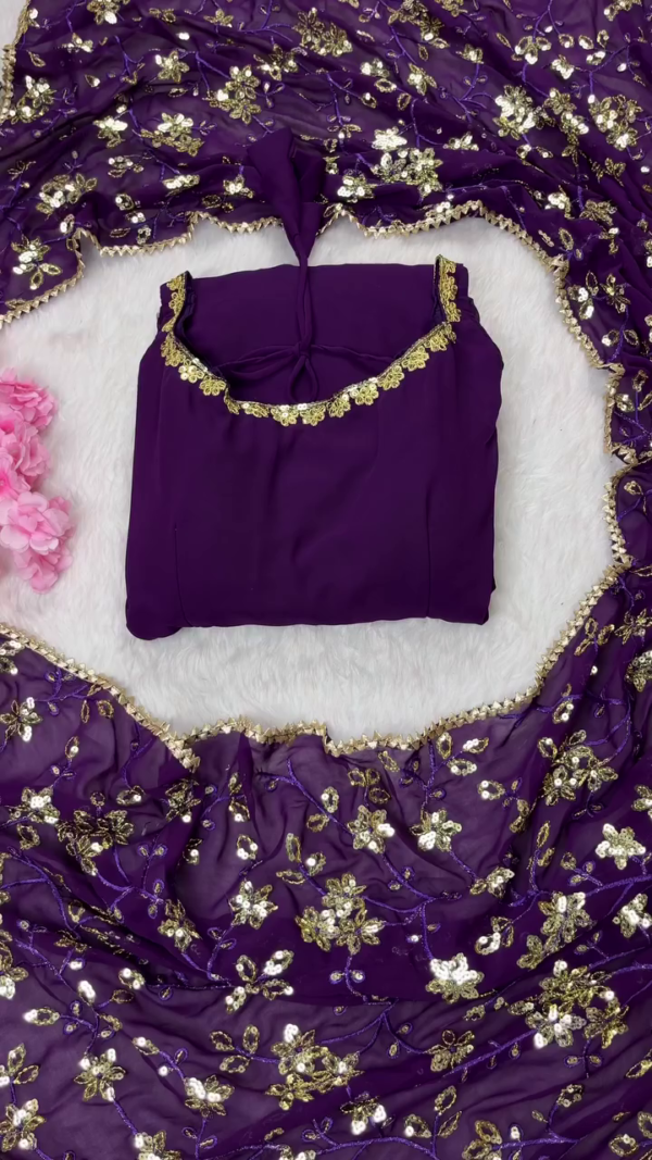 Deep Purple Georgette Anarkali Suit Set Featuring Sleeveless Embroidered Kurta with Golden Lace Detailing, Matching Net Dupatta with Intricate Sequin Floral Work, and Coordinated Bottoms – Perfect for Festive and Traditional Occasions