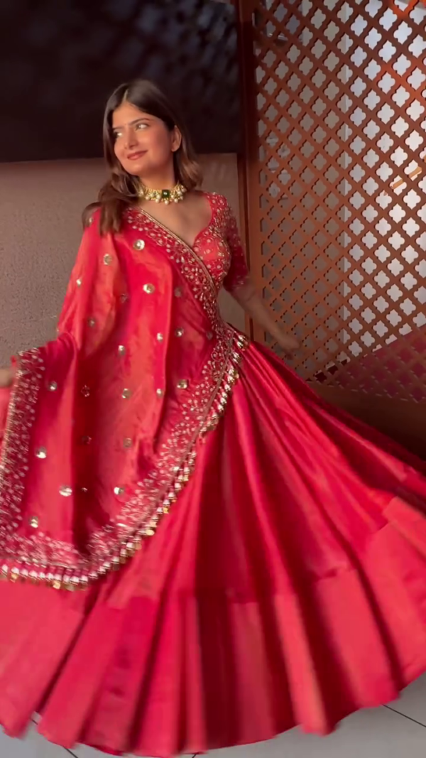 Radiant Red Silk Lehenga Choli Set Featuring Intricately Embroidered V-Neck Blouse, Mirror Work Dupatta with Detailed Border, and Flared Skirt – A Stunning Traditional Ensemble for Festive and Wedding Occasions - Image 2