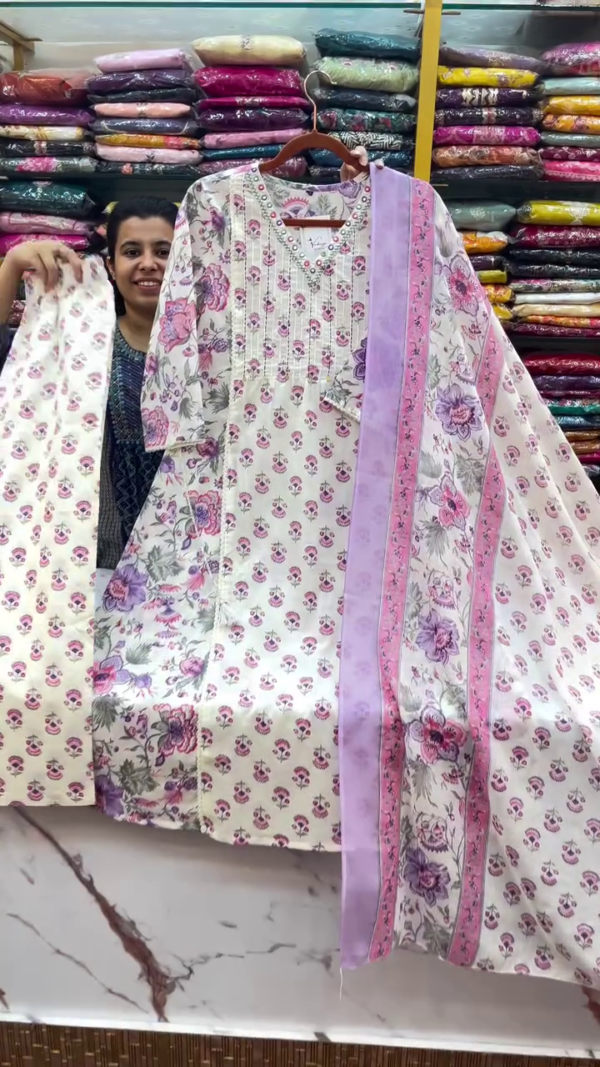 Charming Off-White Floral Printed Straight Kurta Set with Delicate Pearl Detailing on Neckline, Coordinated Printed Bottom, and Soothing Lilac-Pink Floral Dupatta – Perfect for Summer Festivities and Casual Ethnic Outings - Image 2