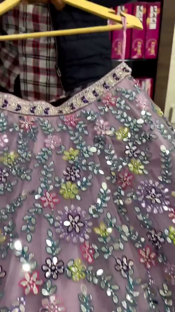 Lavender Purple Net Embroidered Lehenga Choli with Multicolor Sequin and Mirror Work, Intricate Floral Thread Embellishments, Stone-Fringed Dupatta and Scalloped Hemline – Perfect for Weddings, Sangeet, and Festive Occasions - Image 3
