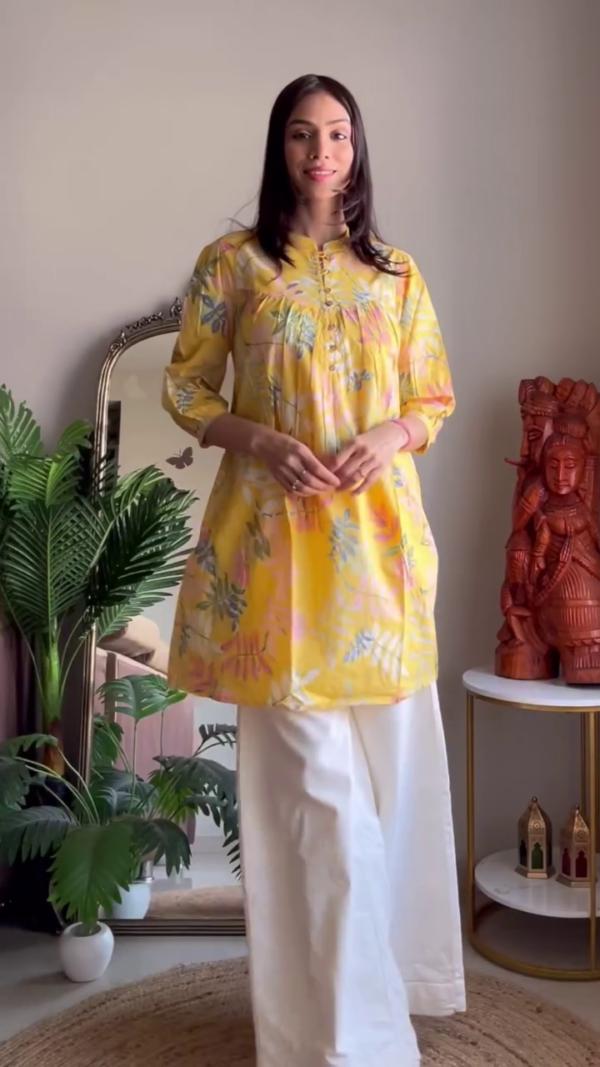 Breezy Summer Multi-Shade Short Kurta Set Featuring Soft Cotton Fabric, Vibrant Floral and Geometric Prints, Delicate Pintuck Detailing, and Comfortable White Palazzo – A Perfect Blend of Style and Ease for Everyday Ethnic Wear