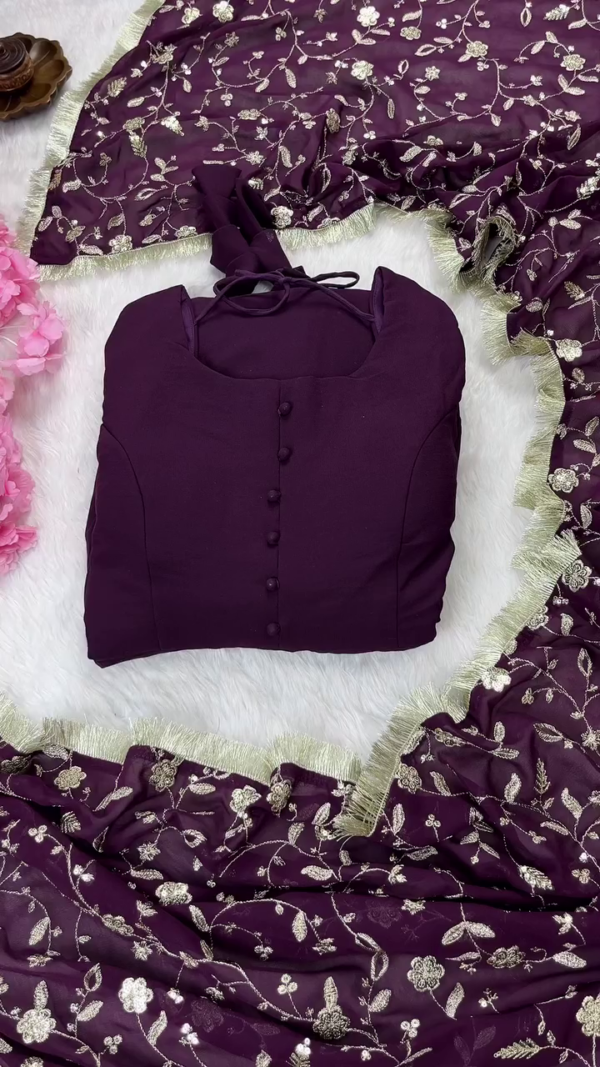 Rich Wine Purple Georgette Anarkali Suit Set Featuring Stylish Sleeveless Kurta with Front Button Detailing, Intricately Embroidered Net Dupatta with Floral Sequin Work and Golden Border, Paired with Matching Solid Bottoms – A Perfect Blend of Elegance and Festive Charm