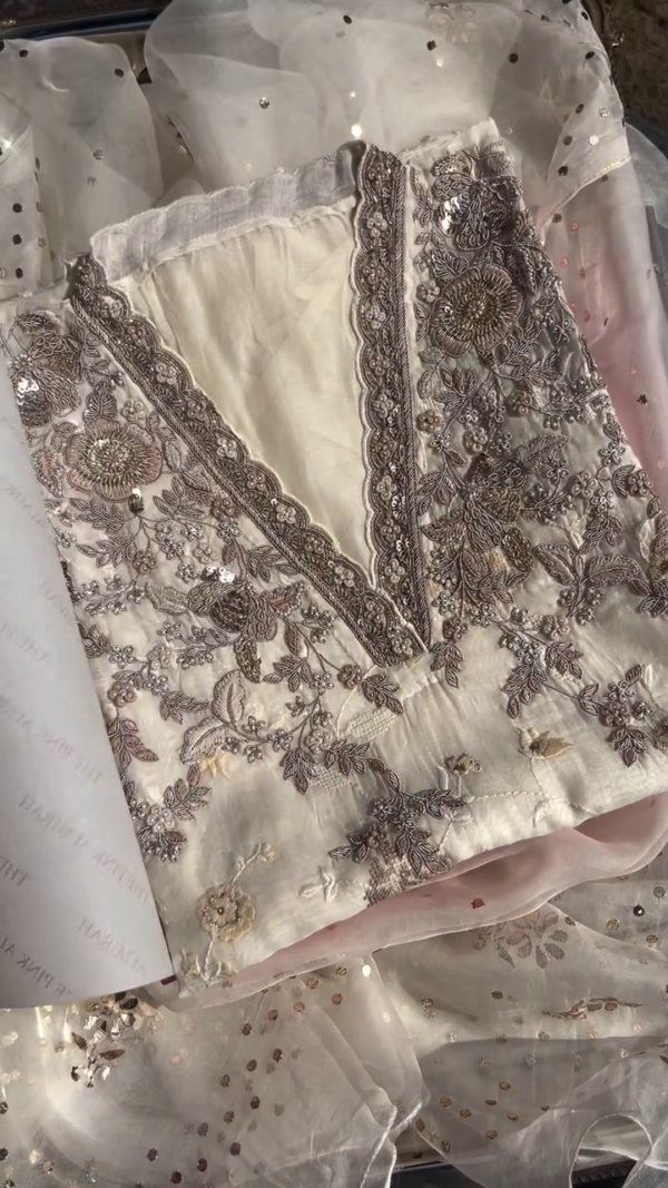 Off-White Chiffon Embroidered Unstitched Suit with Intricate Handwork, Sequins Detailing, and Floral Thread Embellishments Paired with a Sheer Net Dupatta Accented by Golden Polka Dots – Ideal for Festive and Formal Occasions - Image 2