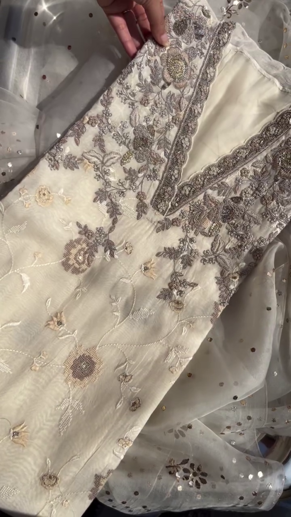 Off-White Chiffon Embroidered Unstitched Suit with Intricate Handwork, Sequins Detailing, and Floral Thread Embellishments Paired with a Sheer Net Dupatta Accented by Golden Polka Dots – Ideal for Festive and Formal Occasions - Image 3