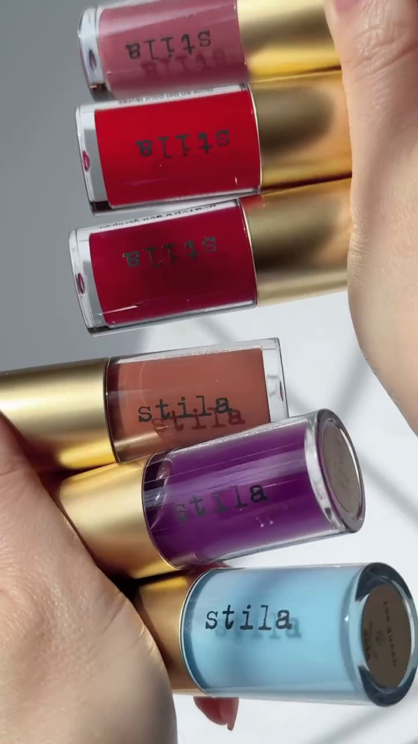 Stila Lip Glosses – Vibrant Liquid Lipsticks in Red, Purple, and Blue Shades for Bold and Colorful Lips.