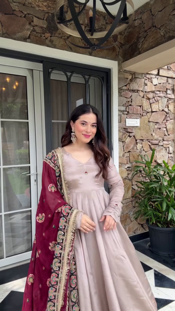 Serene Elegance: Soft Beige Ensemble with Rich Maroon Accents and Intricate Embroidery