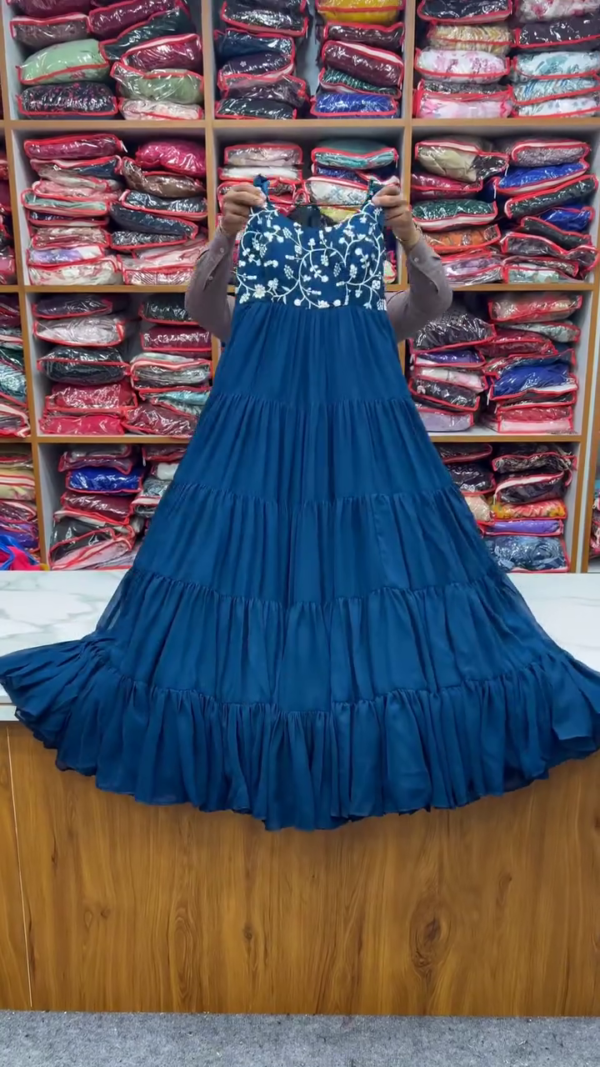 Elegant Blue Tiered Dress with Intricate Floral Embroidery on the Bodice, Paired with a Matching Dupatta and Bottom