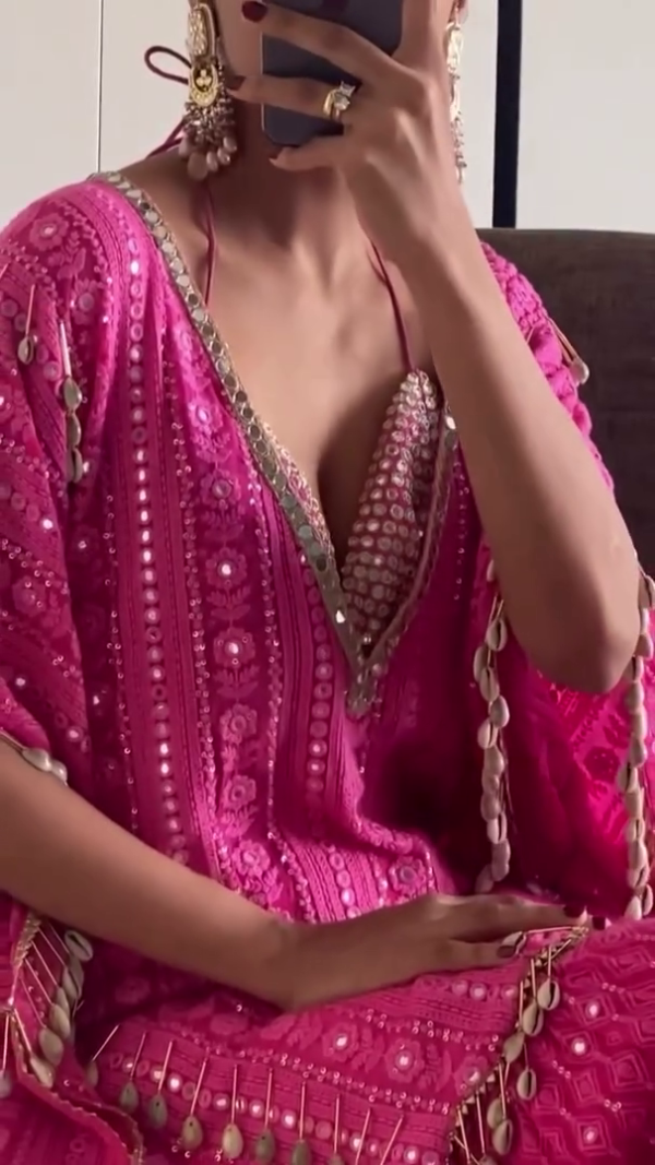 Striking in a Vibrant Pink Traditional Outfit with Intricate Embroidery and Tassel Detailing, Paired with Matching Embellished Flared Pants for a Modern Ethnic Look - Image 2