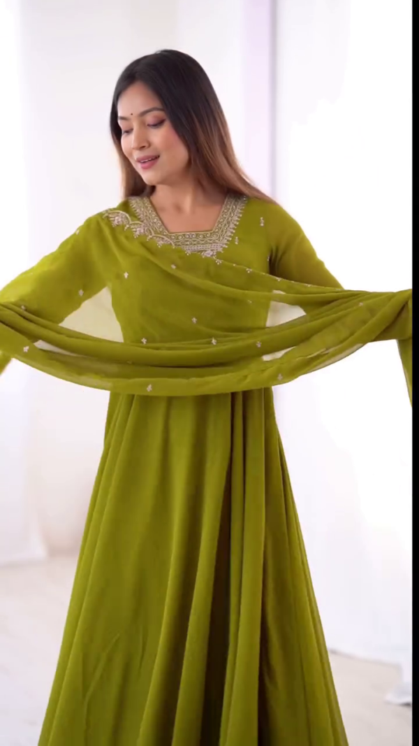 Refreshing Elegance: Vibrant Green Ensemble with Intricate Embroidery and Flowing Grace - Image 2