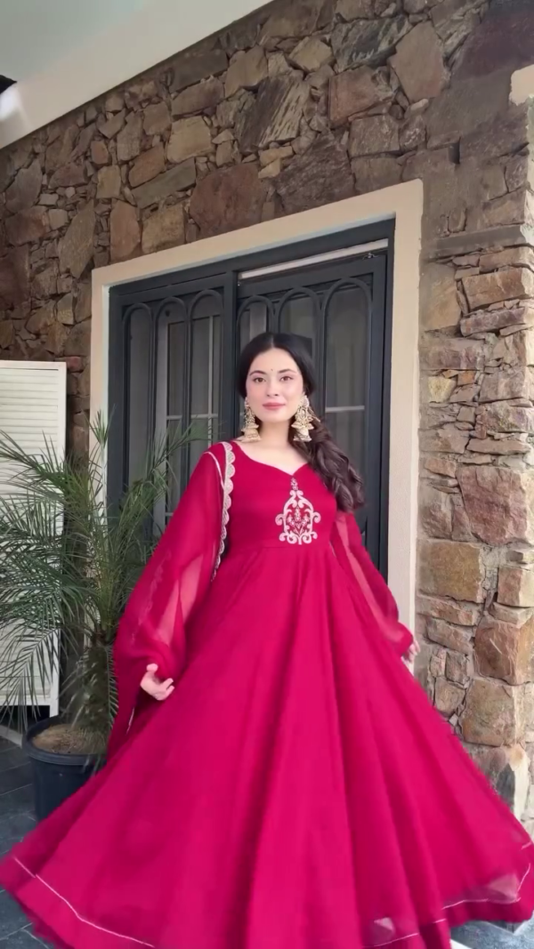 Elegant Red Anarkali Dress with Intricate Embroidery, Flowing Sleeves, and a Graceful Dupatta for Festive and Formal Occasions
