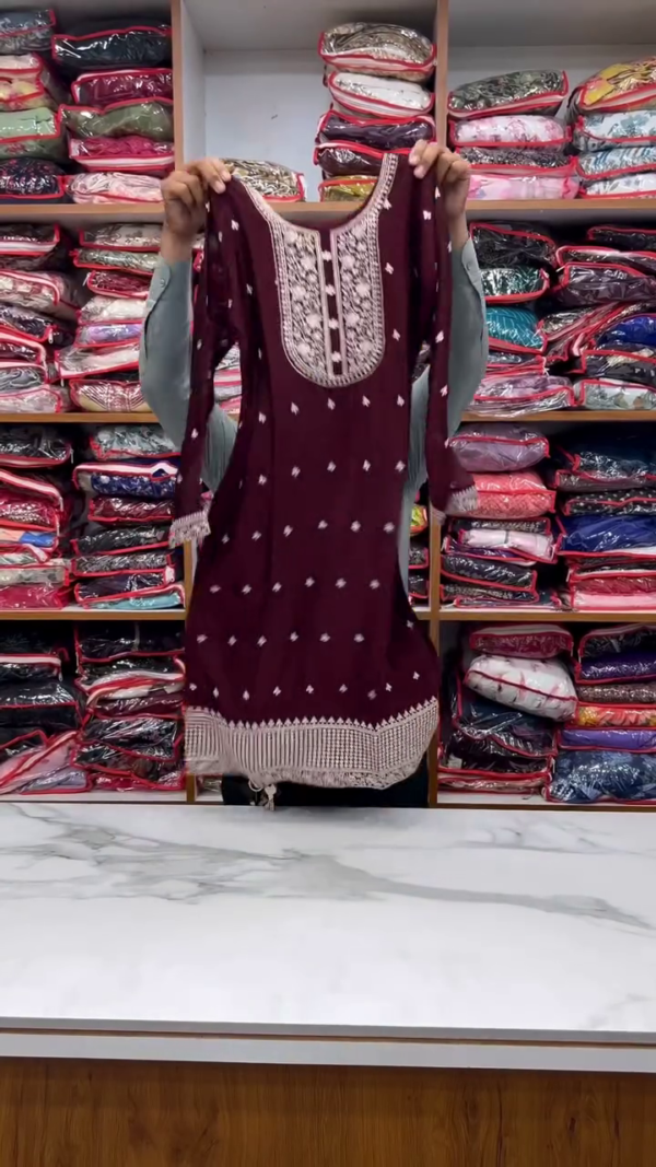 Elegant Maroon Straight-Cut Kurta Set with Heavily Embroidered Yoke & Border – Paired with a Delicate Net Dupatta Featuring Floral Threadwork and Tassel Edges – Perfect for Festive & Formal Occasions - Image 2