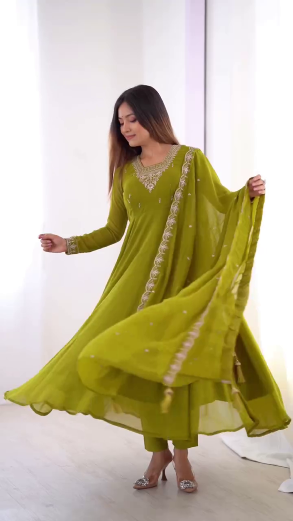 Refreshing Elegance: Vibrant Green Ensemble with Intricate Embroidery and Flowing Grace
