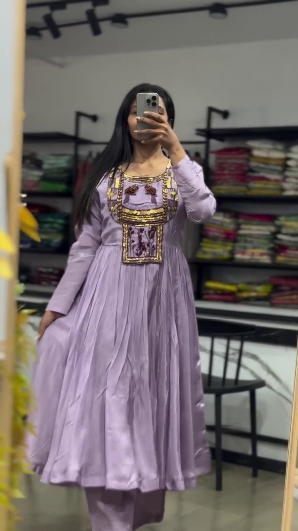 Elegant Lavender Dress with Intricate Embroidered Detailing and Flowy Pleat