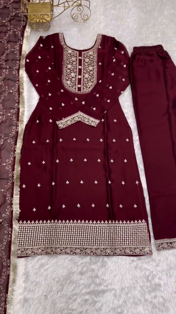 Elegant Maroon Straight-Cut Kurta Set with Heavily Embroidered Yoke & Border – Paired with a Delicate Net Dupatta Featuring Floral Threadwork and Tassel Edges – Perfect for Festive & Formal Occasions