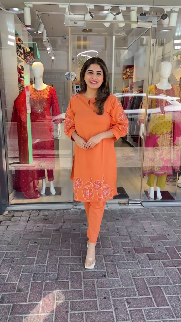 Chic Orange Straight-Cut Kurta Set with White Floral Embroidery – Featuring Puff Sleeves and Minimal Neck Keyhole Detail – Perfect for Casual Outings and Daytime Gatherings