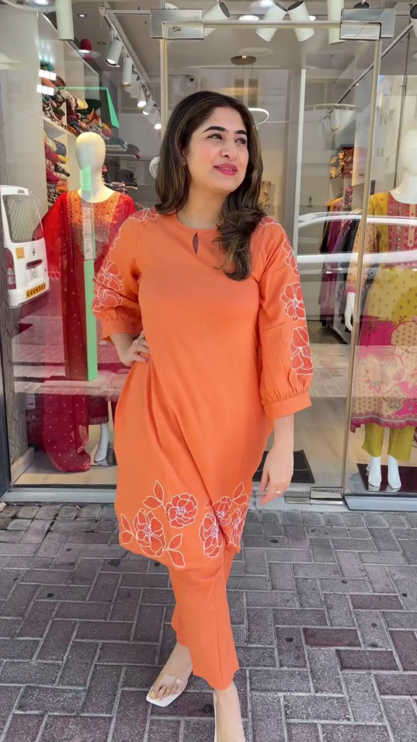 Chic Orange Straight-Cut Kurta Set with White Floral Embroidery – Featuring Puff Sleeves and Minimal Neck Keyhole Detail – Perfect for Casual Outings and Daytime Gatherings - Image 2
