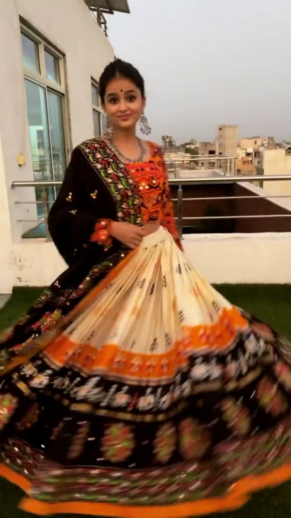Ivory & Orange Mirror Work Chaniya Choli with Embroidered Black Dupatta – Vibrant Navratri Special