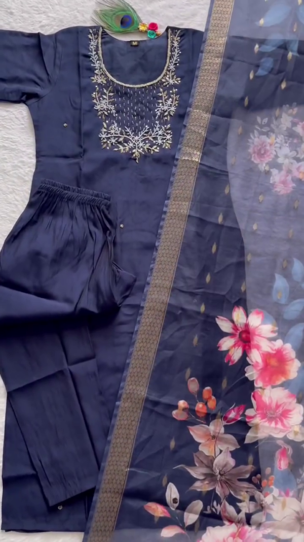 Elegant Navy Blue Suit Set adorned with delicate silver embroidery on the neckline. Paired with a soft floral organza dupatta featuring vibrant multicolor blossoms and a golden border. - Image 2