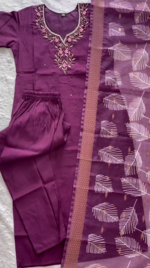 Graceful Purple Suit Set featuring intricate floral embroidery on the neckline paired with a sheer printed dupatta highlighted by white leaf motifs and a contrasting border. - Image 2
