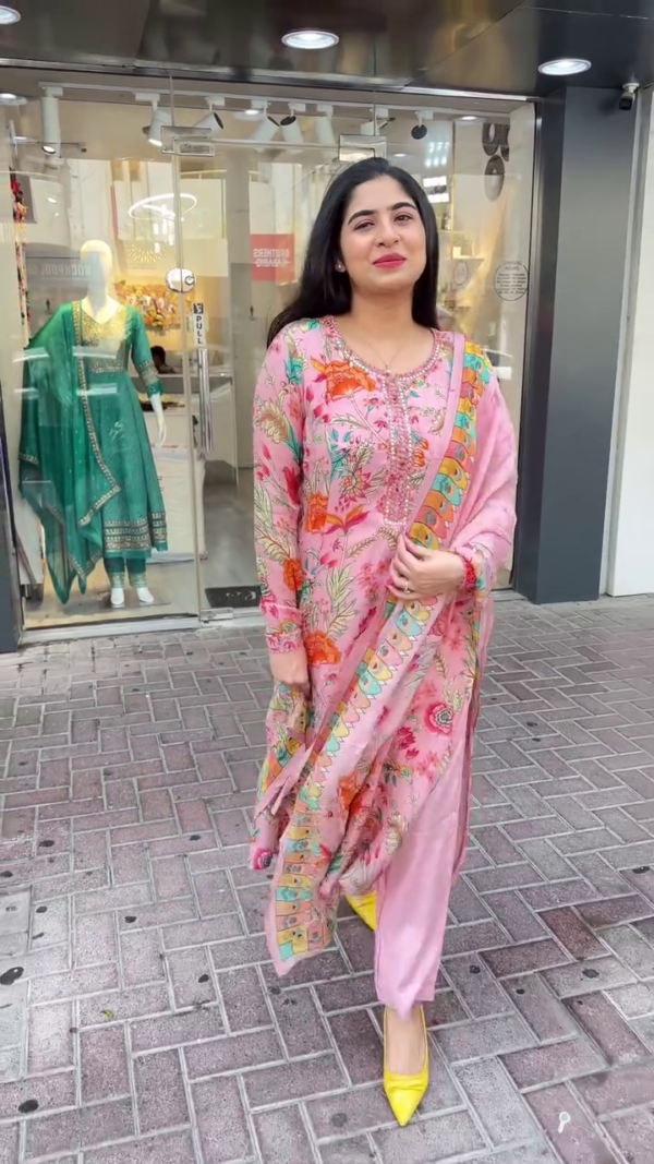 Floral Printed Pastel Suit Set in Pink and Mint Green – Featuring Elegant Thread and Sequin Embroidery on the Neckline, Paired with a Digitally Printed Dupatta Showcasing Multicolor Festive Motifs – A Breezy and Stylish Ensemble Perfect for Daytime Events, Festive Gatherings, and Summer Celebrations.