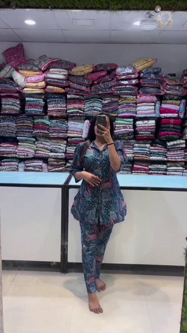 A breezy and stylish co-ord set in deep teal with abstract botanical prints in shades of pink and blue. Featuring a relaxed button-down top with a collar and elbow-length sleeves — perfect for effortless daywear or lounging in style.