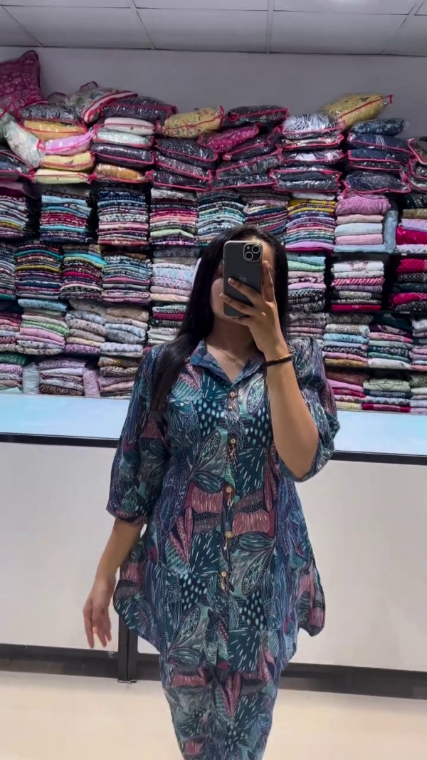 A breezy and stylish co-ord set in deep teal with abstract botanical prints in shades of pink and blue. Featuring a relaxed button-down top with a collar and elbow-length sleeves — perfect for effortless daywear or lounging in style. - Image 2
