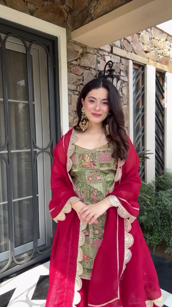 A stunning green and red ethnic outfit featuring intricate embroidery, paired with a matching dupatta, creating a beautiful blend of traditional and contemporary style, perfect for festive occasions. - Image 2