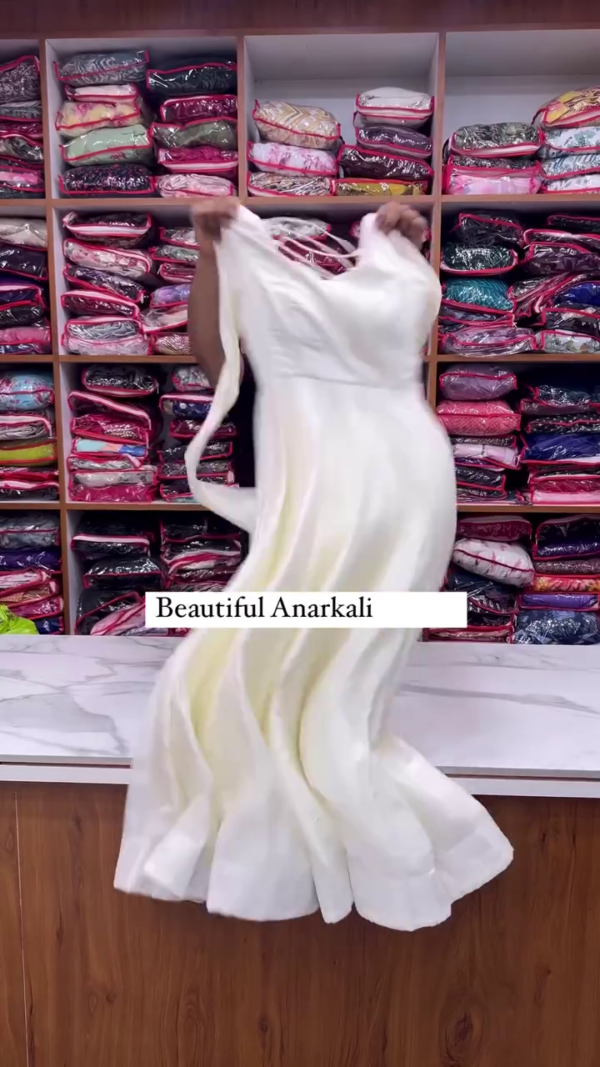 Elegant ivory Anarkali paired with a deep plum dupatta for a royal contrast. A timeless silhouette that radiates grace and festive charm. - Image 2
