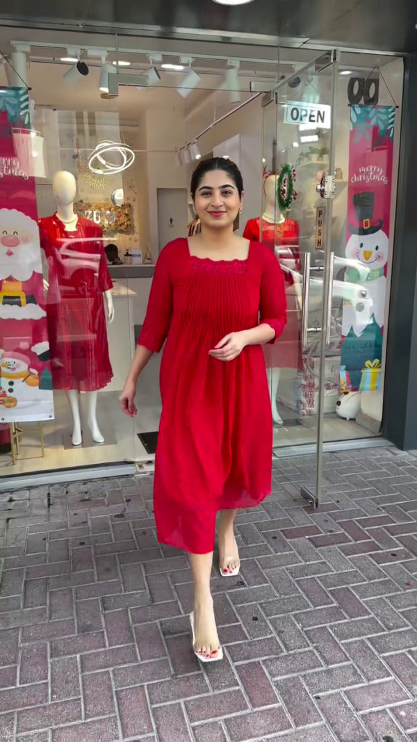 Chic Solid Red Flared Midi Kurta Dress with Delicate Lace Detailing on Square Neckline and Sleeves – Flowy, Lightweight Fabric with Pleated Front and Three-Quarter Sleeves, Perfect for Festive Gatherings, Casual Outings, and Special Day Events