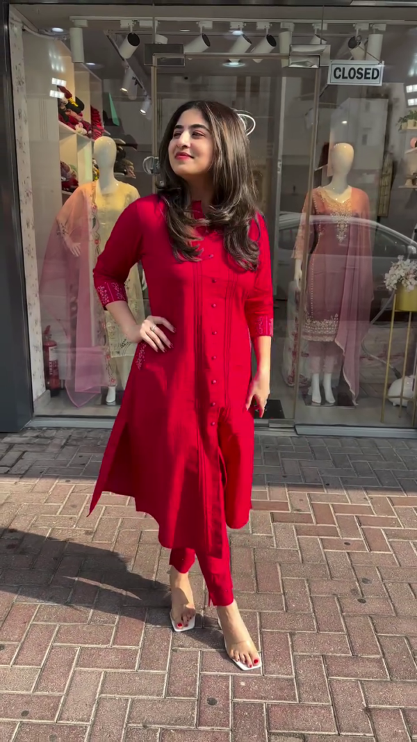 Solid Red Straight-Cut Kurta Set with Fabric Buttons and Tonal Stitch Detailing, Paired with Matching Pants – Crafted in Soft, Comfortable Fabric with Three-Quarter Embroidered Sleeves and Side Slits, Ideal for Workwear, Casual Days, and Elegant Everyday Looks