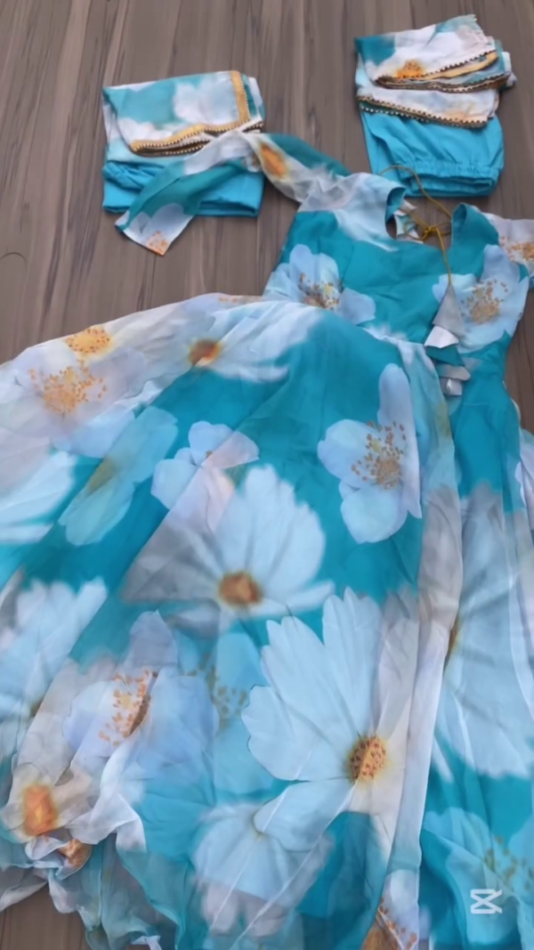 Beautiful Blue Floral Anarkali Set – Flowing Long Dress with White and Yellow Flower Print, Paired with Matching Pants and Dupatta Featuring Golden Lace Border for a Graceful Ethnic Look