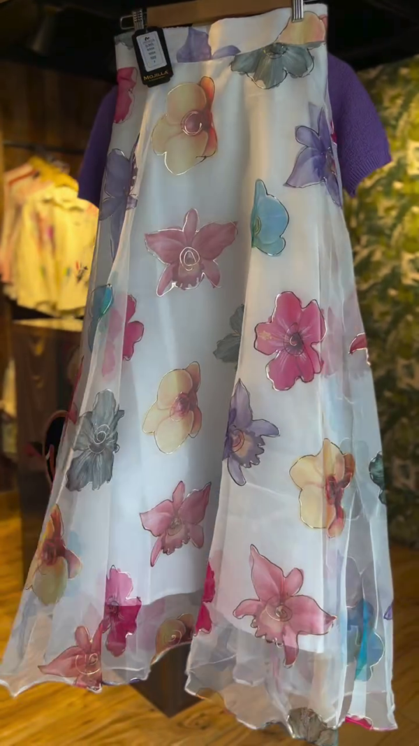 Chic Layered Dress – Soft Purple Short-Sleeve Knit Top Over a Flowing White Sheer Skirt with Vibrant Multicolor Floral Prints for a Playful and Elegant Look - Image 2