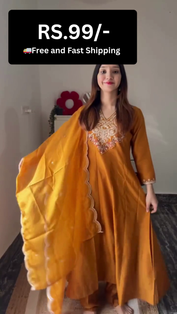 Elegant Anarkali Suit – Rich Mustard Yellow Long Flared Kurta with Intricate Embroidery at the Neckline, Paired with Matching Pants and a Dupatta Featuring Scalloped Edges; Also Available in Sky Blue Color