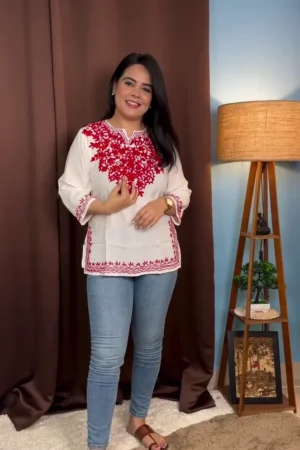 White Kurti with Intricate Red Floral Embroidery on Neckline and Hem, Perfect for Casual and Festive Occasions, Paired with Comfortable Blue Denim