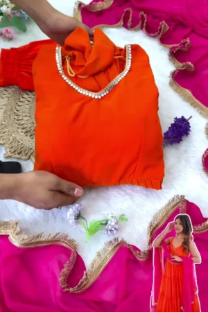Vibrant Party Wear Gown Set with Ruffled Tiered Skirt in Bright Orange: Complete Outfit Featuring Golden Gota Patti Neckline and Contrasting Fuchsia Pink Dupatta with Matching Trousers